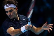 LONDON, ENGLAND - NOVEMBER 26: Roger Federer of Switzerland returns the ball during the men's singles round robin match against Juan Martin Del Potro of Argentina during the Barclays ATP World Tour Finals at the O2 Arena on November 26, 2009 in London, England (Photo by Julian Finney/Getty Images)