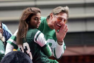NEW YORK - NOVEMBER 25:  Football star Joe Namath yells to the crowd as he passes on a float in Times Square during the 78th Annual Macy's Thanksgiving Day Parade November 25, 2004 in New York City. Thousands attended the parade which featured 15 giant character balloons and 27 floats. (Photo by Mario Tama/Getty Images)