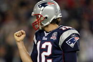 FOXBORO, MA - NOVEMBER 22:  Tom Brady #12 of the New England Patriots celebrates Laurence Maroney's touchdown run in the second quarter against the New York Jets on November 22, 2009 at Gillette Stadium in Foxboro, Massachusetts.  (Photo by Elsa/Getty Images)
