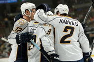 DENVER - NOVEMBER 25:  Marcel Goc #9 of the Nashville Predators is congratulated for his first period goal by Dan Hamhuis #2 and Cody Franson #32 to give Nashville a 2-0 lead over the Colorado Avalanche during NHL action at the Pepsi Center on November 25, 2009 in Denver, Colorado.  (Photo by Doug Pensinger/Getty Images)