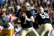 SOUTH BEND, IN - OCTOBER 17: Jimmy Clausen #7 of the Notre Dame Fighting Irish looks for a receiver against the USC Trojans at Notre Dame Stadium on October 17, 2009 in South Bend, Indiana. USC defeated Notre Dame 34-27. (Photo by Jonathan Daniel/Getty Images)