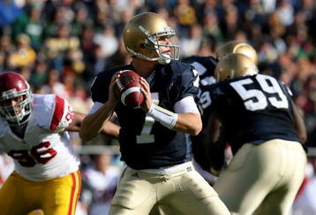 SOUTH BEND, IN - OCTOBER 17: Jimmy Clausen #7 of the Notre Dame Fighting Irish looks for a receiver against the USC Trojans at Notre Dame Stadium on October 17, 2009 in South Bend, Indiana. USC defeated Notre Dame 34-27. (Photo by Jonathan Daniel/Getty Images)