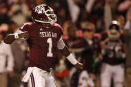 COLLEGE STATION, TX - NOVEMBER 26: Quarterback Jerrod Johnson #1 of the Texas A&M Aggies celebrates after throwing a touchdown pass against the Texas Longhorns in the first half at Kyle Field on November 26, 2009 in College Station, Texas. (Photo by Aaron M. Sprecher/Getty Images)