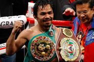 LAS VEGAS - NOVEMBER 14:  Manny Pacquiao celebrates his 12 round TKO victory against Miguel Cotto during their WBO welterweight title fight at the MGM Grand Garden Arena on November 14, 2009 in Las Vegas, Nevada.(Photo by Ethan Miller/Getty Images)