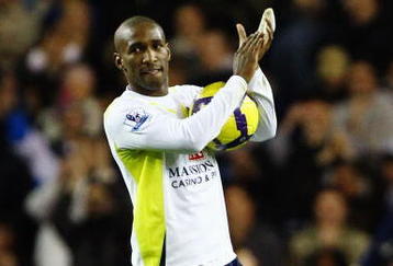 LONDON, ENGLAND - NOVEMBER 22:  Jermain Defoe of Tottenham Hotspur collects the match ball after scoring five during the Barclays Premier League match between Tottenham Hotspur and Wigan Athletic at White Hart Lane on November 22, 2009 in London, England.  (Photo by Clive Rose/Getty Images)