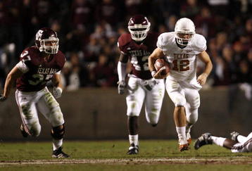 COLLEGE STATION, TX - NOVEMBER 26: Quarterback Colt McCoy #12 of the Texas Longhorns scrambles away from the Texas A&M Aggies defense to score a touchdown in the first half at Kyle Field on November 26, 2009 in College Station, Texas.  (Photo by Aaron M. Sprecher/Getty Images)