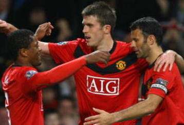 MANCHESTER, ENGLAND - NOVEMBER 21:  Michael Carrick of Manchester United celebrates scoring his team's second goal with team mates Patrice Evra and Ryan Giggs (R) during the Barclays Premier League match between Manchester United and Everton at Old Trafford on November 21, 2009 in Manchester, England.  (Photo by Alex Livesey/Getty Images)