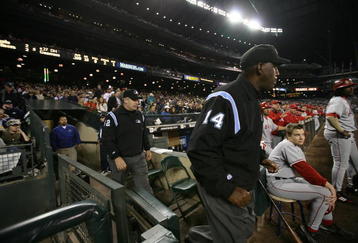 SEATTLE - SEPTEMBER 24:  Umpires Chuck Meriwether #14 and Bill Welke #52 emerge from the tunnel after having reviewed a call on replay for the first time in Mariners history during the game between the Seattle Mariners and the Los Angeles Angels of Anaheim at Safeco Field September 24, 2008 in Seattle, Washington. The review delayed the game for 2 minutes and 28 seconds. (Photo by Otto Greule Jr/Getty Images)