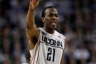 DETROIT - APRIL 04:  Stanley Robinson #21 of the Connecticut Huskies reacts while taking on the Michigan State Spartans during the National Semifinal game of the NCAA Division I Men's Basketball Championship at Ford Field on April 4, 2009 in Detroit, Michigan.  (Photo by Andy Lyons/Getty Images)
