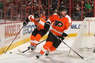 PHILADELPHIA - NOVEMBER 12: Mike Richards #18 of the Philadelphia Flyers skates with the puck behind teammate Scott Hartnell #19 against the Ottawa Senators at the Wachovia Center on November 12, 2009 in Philadelphia, Pennsylvania.  (Photo by Nick Laham/Getty Images)