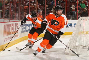 PHILADELPHIA - NOVEMBER 12: Mike Richards #18 of the Philadelphia Flyers skates with the puck behind teammate Scott Hartnell #19 against the Ottawa Senators at the Wachovia Center on November 12, 2009 in Philadelphia, Pennsylvania.  (Photo by Nick Laham/Getty Images)