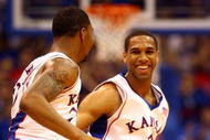 LAWRENCE, KS - NOVEMBER 25:  Xavier Henry #1 of the Kansas Jayhawks celebrates with Marcus Morris #22 after scoring during the game against the Oakland Golden Grizzlies on November 25, 2009 at Allen Fieldhouse in Lawrence, Kansas.  (Photo by Jamie Squire/Getty Images)
