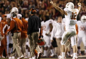 COLLEGE STATION, TX - NOVEMBER 26: Quarterback Colt McCoy #12 of the Texas Longhorns celebrates against the Texas A&M Aggies in the second half at Kyle Field on November 26, 2009 in College Station, Texas. The Longhorns defeated the Aggies 49-39.(Photo by Aaron M. Sprecher/Getty Images)