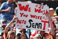 HONOLULU, HI - FEBRUARY 10: Young fans hold up a sign in memory of Sean Taylor #21 of the NFC's Washington Redskins during the game against the AFC at the 2008 NFL Pro Bowl at Aloha Stadium on February 10, 2008 in Honolulu, Hawaii. (Photo by Paul Spinelli/Getty Images)
