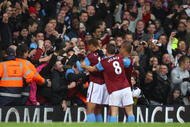 BIRMINGHAM, ENGLAND - NOVEMBER 07:   John Carew of Aston Villa celebrates his goal with the fans during the Barclays Premier League match between Aston Villa and Bolton Wanderers at Villa Park on November 7, 2009 in Birmingham, England.  (Photo by Mark Thompson/Getty Images)