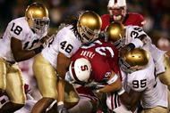 PALO ALTO, CA - NOVEMBER 26:  Nick Frank #35 of Stanford is tackled by Victor Abiamiri #95,Corey Mays #46, and Brandon Hoyte #39 of Notre Dame at a game at Stanford University on November 26, 2005 in Palo Alto, California.  (Photo by Jed Jacobsohn/Getty Image