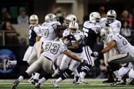 ARLINGTON, TX - NOVEMBER 26:  Running back Felix Jones #28 of the Dallas Cowboys runs the ball against Tyvon Branch #33 of the Oakland Raiders at Cowboys Stadium on November 26, 2009 in Arlington, Texas.  (Photo by Ronald Martinez/Getty Images)
