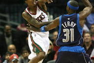 MILWAUKEE - NOVEMBER 16: Brandon Jennings #3 of the Milwuakee Bucks passes the ball over Jason Terry #31 of the Dallas Mavericks at the Bradley Center on November 16, 2009 in Milwaukee, Wisconsin. (Photo by Jonathan Daniel/Getty Images)