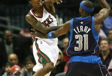 MILWAUKEE - NOVEMBER 16:  Brandon Jennings #3 of the Milwuakee Bucks passes the ball over Jason Terry #31 of the Dallas Mavericks at the Bradley Center on November 16, 2009 in Milwaukee, Wisconsin.  (Photo by Jonathan Daniel/Getty Images)