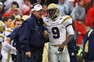 ATHENS, GA - NOVEMBER 29:  Head coach Paul Johnson and quarterback Josh Nesbitt #9 of the Georgia Tech Yellow Jackets share a discussion during a timeout in the game against the Georgia Bulldogs at Sanford Stadium on November 29, 2008 in Athens, Georgia.  The Yellow Jackets defeated the Bulldogs 45-42.  (Photo by Mike Zarrilli/Getty Images)