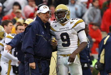 ATHENS, GA - NOVEMBER 29:  Head coach Paul Johnson and quarterback Josh Nesbitt #9 of the Georgia Tech Yellow Jackets share a discussion during a timeout in the game against the Georgia Bulldogs at Sanford Stadium on November 29, 2008 in Athens, Georgia.  The Yellow Jackets defeated the Bulldogs 45-42.  (Photo by Mike Zarrilli/Getty Images)