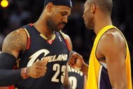 LOS ANGELES, CA - JANUARY 19:  LeBron James #23 of the Cleveland Cavaliers greets Kobe Bryant #24 of the Los Angeles Lakers after Kobe injures his hand during the first quarter at Staples Center on January 19, 2009 in Los Angeles, California.  (Photo by Harry How/Getty Images)