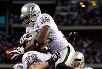 ARLINGTON, TX - NOVEMBER 26:  Wide receiver Darrius Heyward-Bey #12 of the Oakland Raiders celebrates a touchdown with Robert Gallery #76 against the Dallas Cowboys at Cowboys Stadium on November 26, 2009 in Arlington, Texas.  (Photo by Ronald Martinez/Getty Images)