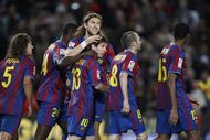 BARCELONA, SPAIN - NOVEMBER 07:  Lionel Messi of Barcelona celebrates with Dmitro Chygrinskiy (C) after scoring a penalty kick during the La Liga match between Barcelona and Mallorca at the Camp Nou Stadium on November 7, 2009 in Barcelona, Spain.  (Photo by Angel Martinez/Getty Images)