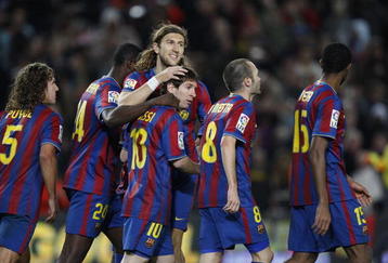 BARCELONA, SPAIN - NOVEMBER 07:  Lionel Messi of Barcelona celebrates with Dmitro Chygrinskiy (C) after scoring a penalty kick during the La Liga match between Barcelona and Mallorca at the Camp Nou Stadium on November 7, 2009 in Barcelona, Spain.  (Photo by Angel Martinez/Getty Images)