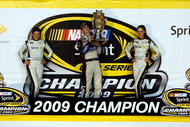 HOMESTEAD, FL - NOVEMBER 22:  (C) Jimmie Johnson, driver of the #48 Lowe's Chevrolet, celebrates after winning the NASCAR Sprint Cup Series Championship after finishing in fifth place in the Ford 400 at Homestead-Miami Speedway on November 22, 2009 in Homestead, Florida. Johnson becomes the first driver in the history of NASCAR to win four consecutive championships since the sports inception in 1949.during the NASCAR Sprint Cup Series Ford 400 at Homestead-Miami Speedway on November 22, 2009 in Homestead, Florida.  (Photo by Chris Graythen/Getty Images)
