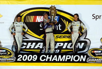 HOMESTEAD, FL - NOVEMBER 22:  (C) Jimmie Johnson, driver of the #48 Lowe's Chevrolet, celebrates after winning the NASCAR Sprint Cup Series Championship after finishing in fifth place in the Ford 400 at Homestead-Miami Speedway on November 22, 2009 in Homestead, Florida. Johnson becomes the first driver in the history of NASCAR to win four consecutive championships since the sports inception in 1949.during the NASCAR Sprint Cup Series Ford 400 at Homestead-Miami Speedway on November 22, 2009 in Homestead, Florida.  (Photo by Chris Graythen/Getty Images)