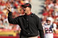 LOS ANGELES, CA - NOVEMBER 14: Head coach Jim Harbaugh of the Stanford Cardinal signals during the game with the USC Trojans on November 14, 2009 at the Los Angeles Coliseum in Los Angeles, California. Stanford won 55-21. (Photo by Stephen Dunn/Getty Images)