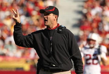 LOS ANGELES, CA - NOVEMBER 14:  Head coach Jim Harbaugh of the Stanford Cardinal signals during the game with the USC Trojans on November 14, 2009 at the Los Angeles Coliseum in Los Angeles, California.  Stanford won 55-21.  (Photo by Stephen Dunn/Getty Images)