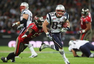LONDON, ENGLAND - OCTOBER 25:  Adam Hayward (#57) of Tampa Bay Buccaneers tries to tackle Wes Welker (#83) of the New England Patriots during the NFL International Series match between New England Patriots and Tampa Bay Buccaneers at Wembley Stadium on October 25, 2009 in London, England. This is the third occasion where a regular season NFL match has been played in London.  (Photo by Elsa/Getty Images)