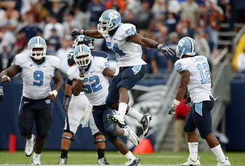EAST HARTFORD, CT - SEPTEMBER 12:  Bruce Carter #54 of the North Carolinia Tar Heels celebrates his sack with teammates Melvin Williams #10, Marvin Austin #9 and Quan Sturdivant #52 in the final minute of the game against the Connecticut Huskies on September 12, 2009 at Rentschler Field in East Hartford, Connecticut. The Tar Heels defeated the Huskies 12-10.  (Photo by Elsa/Getty Images)