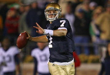 SOUTH BEND, IN - NOVEMBER 21: Jimmy Clausen #7 of the Notre Dame Fighting Irish looks for a receiver in the first overtime period against the Univeristy of Connecticut Huskies at Notre Dame Stadium on November 21, 2009 in South Bend, Indiana. Connecticut defeated Notre Dame 33-30 in double overtime. (Photo by Jonathan Daniel/Getty Images)