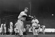 BOSTON, MA - CIRCA 1945:  (UNDATED FILE PHOTO)  Baseball legend Ted Williams (1919 - 2002) of the Boston Red Sox swings a bat at a ball during a pre-game practice as Walter 'Smokey' Baker, the 13-year-old son of Red Sox pitching coach Del Baker (1892 - 1973), watches circa 1945 in Boston, Massachusetts. Williams, 83-years-old, was pronounced dead July 5, 2002 at Citrus County Memorial Hospital in Florida. Williams died of an apparent heart attack.  (Photo by Getty Images)