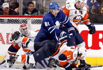TORONTO - NOVEMBER 23: Phil Kessel #81 of the Toronto Maple Leafs hits Nate Thompson #11 of the New York Islanders during game action November 23, 2009 at the Air Canada Centre in Toronto, Ontario, Canada. (Photo by Abelimages/Getty Images)