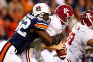 AUBURN, AL - NOVEMBER 27:  Antonio Coleman #52 of the Auburn Tigers sacks quarterback Greg McElroy #12 of the Alabama Crimson Tide at Jordan-Hare Stadium on November 27, 2009 in Auburn, Alabama.  (Photo by Kevin C. Cox/Getty Images)