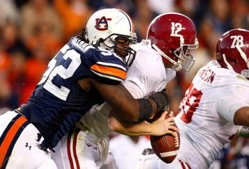 AUBURN, AL - NOVEMBER 27:  Antonio Coleman #52 of the Auburn Tigers sacks quarterback Greg McElroy #12 of the Alabama Crimson Tide at Jordan-Hare Stadium on November 27, 2009 in Auburn, Alabama.  (Photo by Kevin C. Cox/Getty Images)