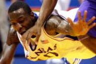 LAWRENCE, KS - NOVEMBER 27:  Tyshawn Taylor #10 of the Kansas Jayhawks dives to try to steal the ball from Zach Bailey #42 of the Tennessee Tech Golden Eagles during the game on November 27, 2009 at Allen Fieldhouse in Lawrence, Kansas.  (Photo by Jamie Squire/Getty Images)