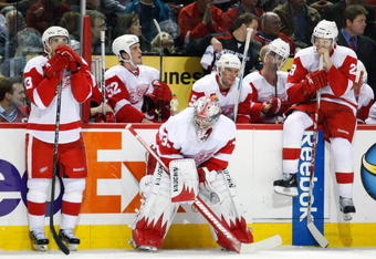 MONTREAL- NOVEMBER 21:  Jimmy Howard #35 of the Detroit Red Wings waits with team mates Pavel Datsyuk #13 and Brad Stuart #23 for the shootout round to begin during the NHL game against the Montreal Canadiens on November 21, 2009 at the Bell Centre in Montreal, Quebec, Canada.  The Red Wings defeated the Canadiens 3-2 in a shootout.  (Photo by Richard Wolowicz/Getty Images)