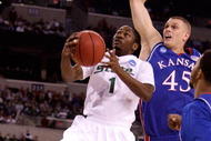 INDIANAPOLIS - MARCH 27: Kalin Lucas #1 of the Michigan State Spartans drives for a shot attempt against Cole Aldrich #45 of the Kansas Jayhawks during the third round of the NCAA Division I Men's Basketball Tournament at the Lucas Oil Stadium on March 27, 2009 in Indianapolis, Indiana. (Photo by Andy Lyons/Getty Images)