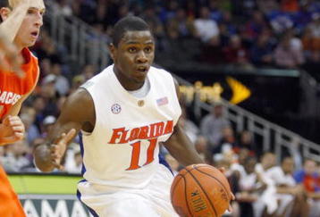KANSAS CITY, MO - NOVEMBER 24: Erving Walker #11 of the Florida Gators drives the ball downcourt against the Syracuse Orange during the CBE Classic game on November 24, 2008 at the Sprint Center in Kansas City, Missouri. (Photo by Jamie Squire/Getty Images)