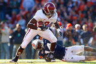 AUBURN, AL - NOVEMBER 27: Julio Jones #8 of the Alabama Crimson Tide tries to break a tackle by Barrett Trotter #14 of the Auburn Tigers at Jordan-Hare Stadium on November 27, 2009 in Auburn, Alabama. (Photo by Kevin C. Cox/Getty Images)