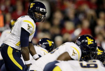 CINCINNATI - NOVEMBER 13:   Quarterback Jarrett Brown #16 of the West Virginia Mountaineers calls out a play against the Cincinnati Bearcats in the first quarter of the game at Nippert Stadium on November 13, 2009 in Cincinnati, Ohio.  (Photo by Andy Lyons/Getty Images)