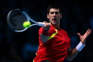 LONDON, ENGLAND - NOVEMBER 27: Novak Djokovic of Serbia returns the ball during the men's singles round robin match against Rafael Nadal of Spain during the Barclays ATP World Tour Finals at the O2 Arena on November 27, 2009 in London, England. (Photo by Clive Brunskill/Getty Images)