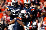 AUBURN, AL - NOVEMBER 27: Terrell Zachery #81 (L) of the Auburn Tigers celebrates his touchdown against the Alabama Crimson Tide with Mario Fannin #27 and Darvin Adams #89 at Jordan-Hare Stadium on November 27, 2009 in Auburn, Alabama. (Photo by Kevin C. Cox/Getty Images)