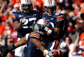 AUBURN, AL - NOVEMBER 27:  Terrell Zachery #81 (L) of the Auburn Tigers celebrates his touchdown against the Alabama Crimson Tide with Mario Fannin #27 and Darvin Adams #89 at Jordan-Hare Stadium on November 27, 2009 in Auburn, Alabama.  (Photo by Kevin C. Cox/Getty Images)