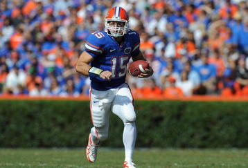 GAINESVILLE, FL - NOVEMBER 21: Quarterback Tim Tebow #15 of the Florida Gators runs for a 55-yard first-half touchdown against the Florida International University Golden Panthers, November 21, 2009 at Ben Hill Griffin Stadium in Gainesville, Florida.  (Photo by Al Messerschmidt/Getty Images)